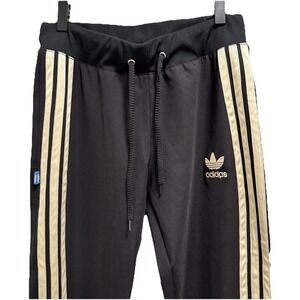 Adidas Originals Chile 20 track pants in black and gold L